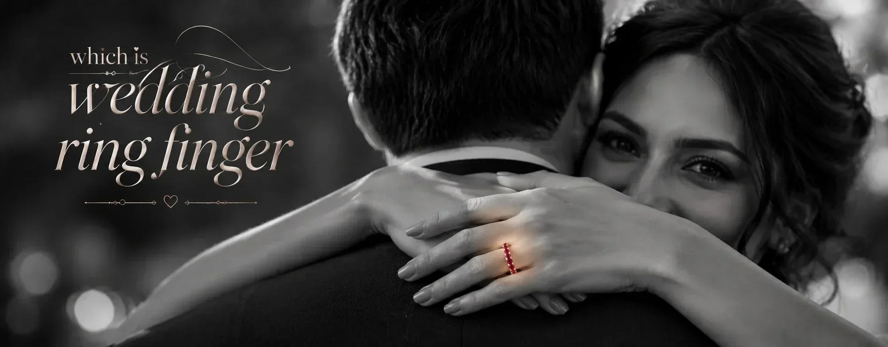 Romantic monochrome couple embracing with a ruby eternity wedding ring highlighted on the woman’s left ring finger, illustrating wedding ring finger traditions.