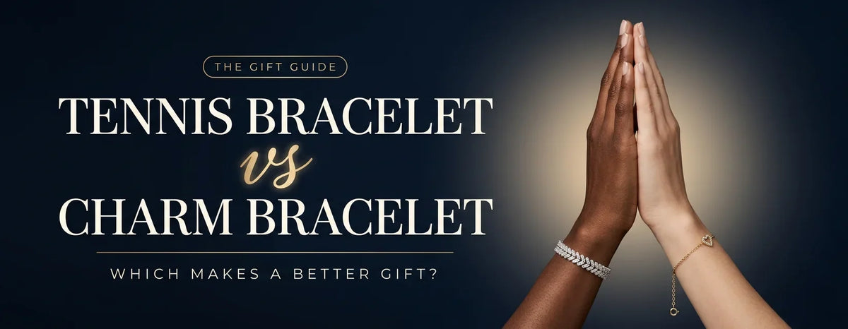 Two hands pressed together wearing a gold heart charm bracelet and a white gold diamond tennis bracelet