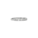 This white gold ring displayed on side view is made with brilliant round diamond and baguette diamond set in prong setting