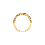 This yellow gold ring displayed on through finger view is made with brilliant round diamond and baguette diamond set in prong setting