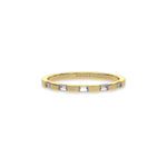 This yellow gold Half Eternity Distance Diamond Band made with baguette diamonds and arranged at intervals creating and alternating pattern between gold and diamond in top view