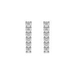 Pair of vertical bar studs set in white gold, featuring a classic prong-set round diamond stud earring design with a row of round stones.