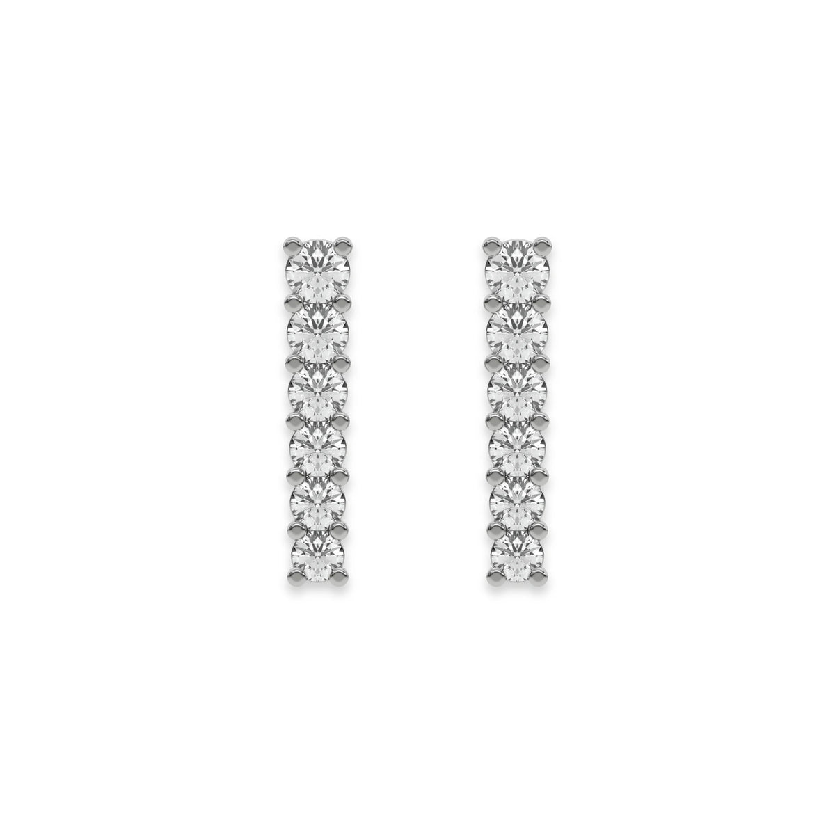 Pair of vertical bar studs set in white gold, featuring a classic prong-set round diamond stud earring design with a row of round stones.