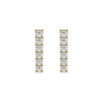 Pair of vertical bar studs set in yellow gold, featuring a classic prong-set round diamond stud earring design with a row of round stones.