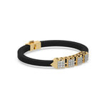 This yellow gold  axel diamond rubber bracelet features two box motifs in the center and two box motifs with arrows on each end. The bracelet elegantly showcases 36 diamonds set in a four-prong setting in side view