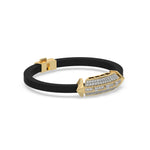 This yellow gold  infinity diamond rubber bracelet, a striking statement piece featuring two diamond rows on each end and a central bar line made with gold motifs and diamonds, all set in a prong setting in side view