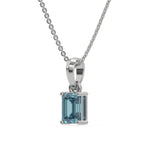 This white gold Fancy Blue Emerald Solitaire Diamond Necklace made with an fancy Blue emerald cut diamond in a four prong setting with adjustable chain in side view