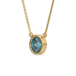 This yellow gold Fancy Blue Oval Solitaire Diamond Necklace made with an fancy Blue oval cut diamond in bezel setting with adjustable chain in side view