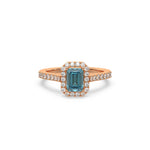 This rose gold ring displayed in front view is made with a Emerald solitaire diamond set in four-prong setting