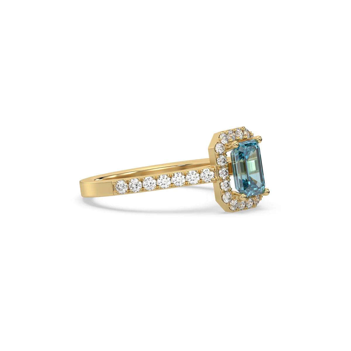 This yellow gold ring displayed in side view is made with a Emerald solitaire diamond set in four-prong setting