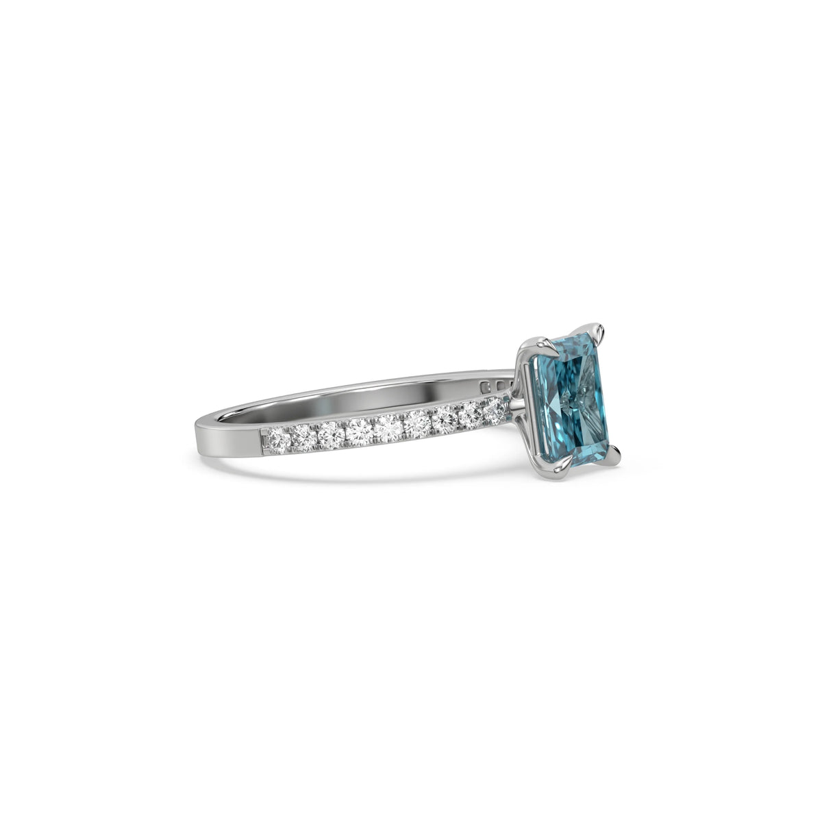 This white gold ring displayed in side  view is made with a radiant solitaire diamond set in four-prong setting