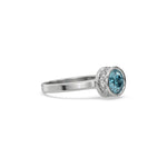 This white gold ring displayed on side view is made with brilliant round solitaire diamond set in bezel setting