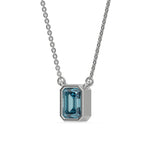 This white gold Fancy Blue Emerald Solitaire Diamond Necklace made with an fancy Blue emerald cut diamond in bezel setting with adjustable chain in side view