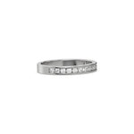 This white  gold ring displayed in side view is made with 15 brilliant cut round diamonds and set in channel setting on ring finger