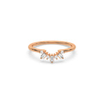 This rose gold ring displayed in front view is made with round brilliant-cut diamonds and baguette diamonds all set in a shared prong setting