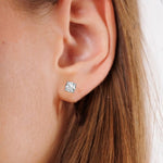 This white gold Classic Round Diamond Studs made with round brilliant-cut diamonds set in a four prong setting