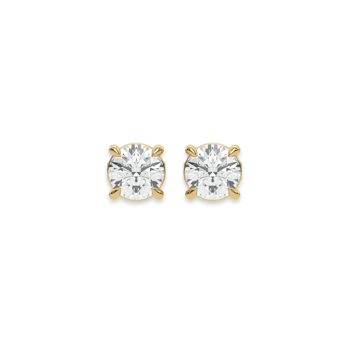 Close up of a pair of earrings featuring a Round diamond stud earring in prong-set and white gold on a white background.