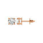 Close up of a pair of earrings featuring a Round diamond stud earring in prong-set and Rose gold on a white background.