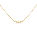 This yellow gold Necklace with five round diamonds arranged in gradually decreasing sizes from the center, each securely set in bezel in top view