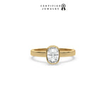 This yellow gold ring displayed on front view is made with brilliant round solitaire diamond set in bezel setting