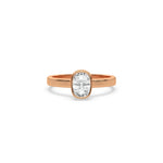 This rose gold ring displayed on front view is made with cushion  solitaire diamond set in bezel setting