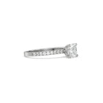 This white gold ring displayed in side view is made with a cushion solitaire diamond set in four-prong setting