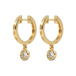 This yellow gold dangling diamond hoop earrings features a moving 0.25 CT diamond on each hoop, securely set in a bezel setting in side view