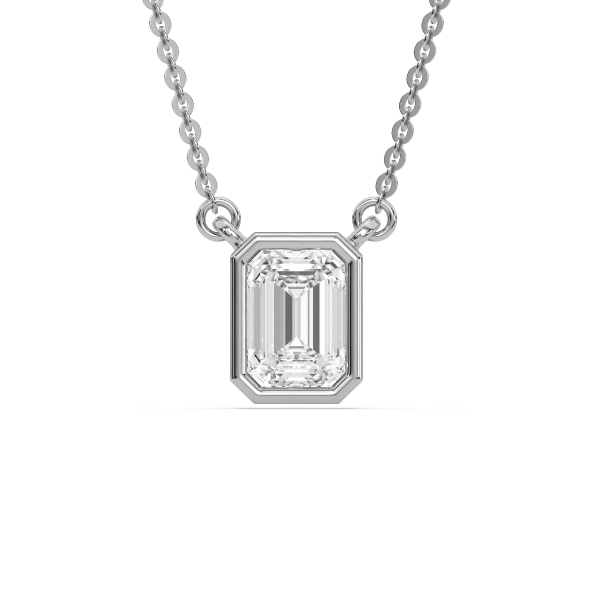 Elegant white gold Emerald Diamond necklace showcasing a brilliant bezel-set emerald cut diamond on a fine chain.