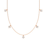 Round Dangling Diamond Necklace made with five round brilliant-cut diamonds each set in a prong setting, distributed evenly along the chain