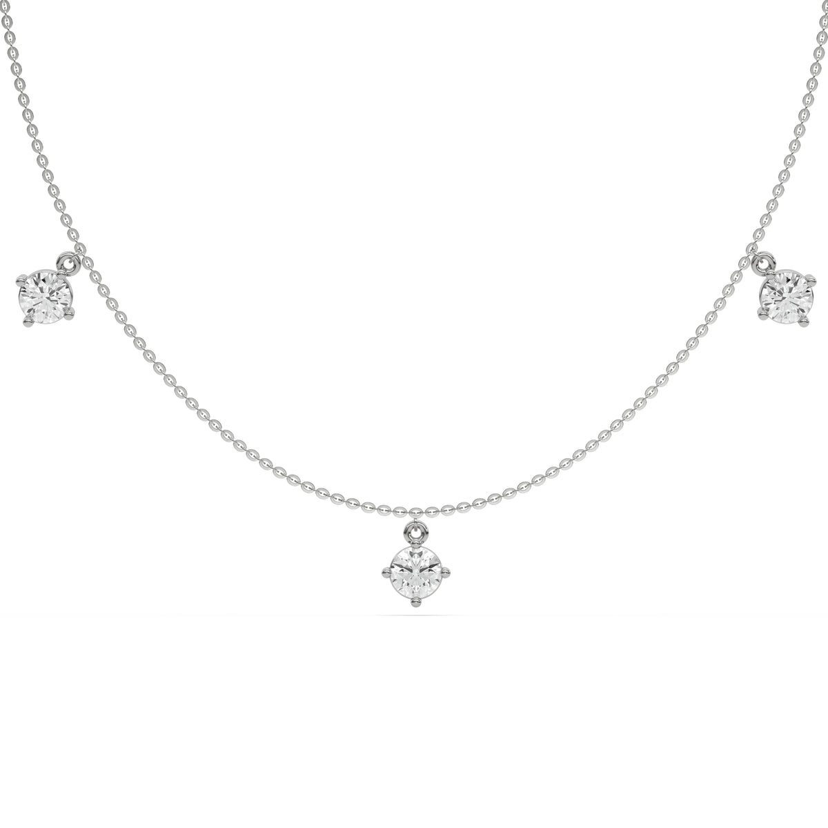 Round Dangling Diamond Necklace made with five round brilliant-cut diamonds each set in a prong setting, distributed evenly along the chain