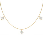 Round Dangling Diamond Necklace made with five round brilliant-cut diamond set in a prong setting, distributed evenly along the chain