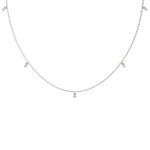 Modern white gold round diamond dangling necklace designed with three brilliant prong-set round stones on a fine link chain with a white background.