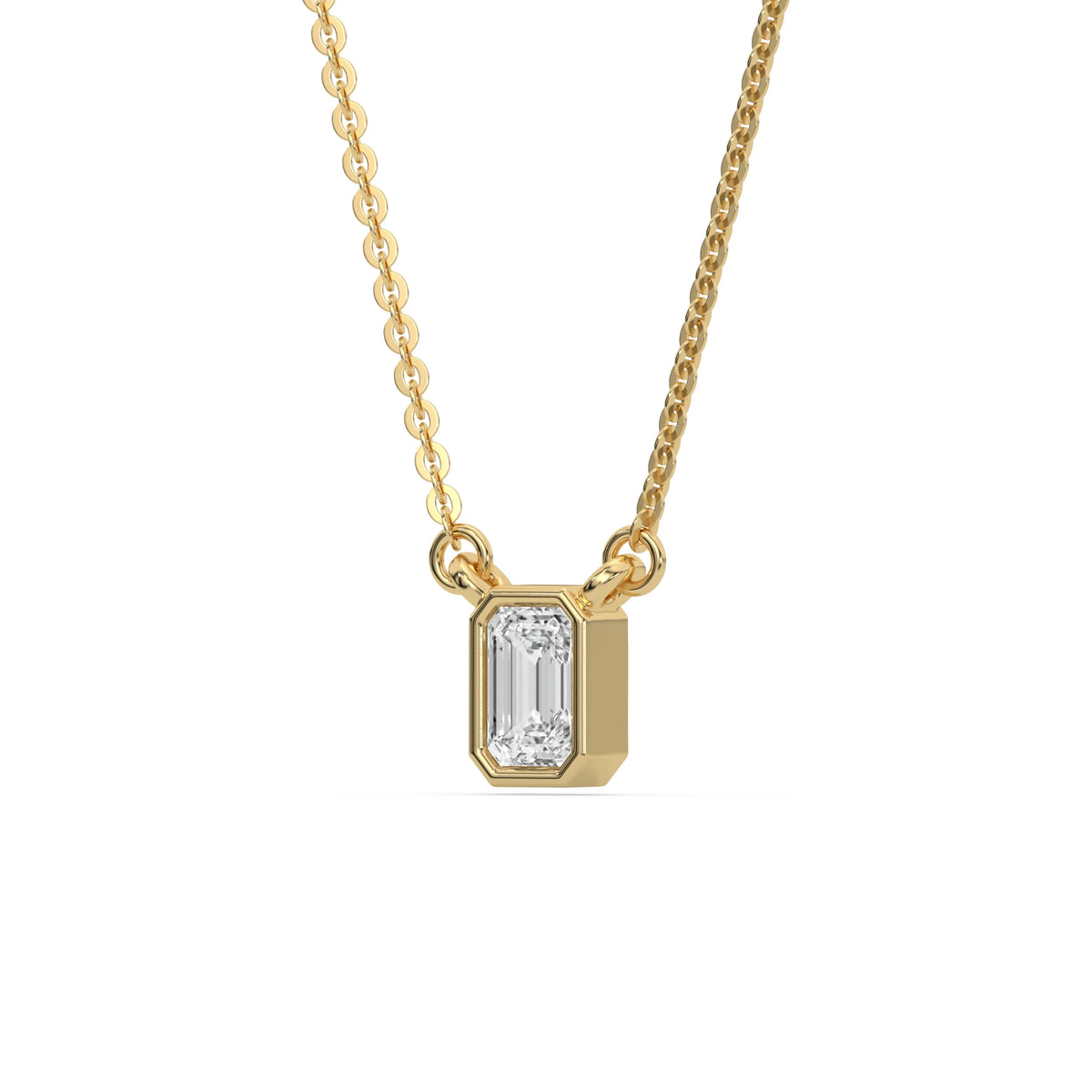 Side-angled view of a bezel-set Emerald Diamond necklace highlighting the solid yellow gold solitaire pendant setting with a white background.