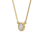 This yellow gold Oval Solitaire Diamond Necklace made with an oval cut diamond in bezel setting with adjustable chain in side view