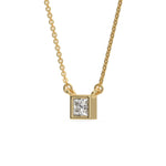 Side-angled view of a square princess Diamond necklace featuring a sparkling stone bezel-set in smooth yellow gold on a fine chain.