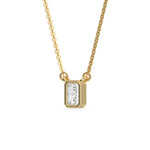 Side-angled view of a bezel-set radiant Diamond necklace highlighting the solid yellow gold solitaire pendant setting.