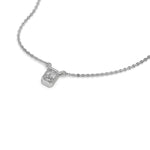 High-angle view of a bezel-set radiant Diamond necklace featuring an elongated solitaire stone in white gold.
