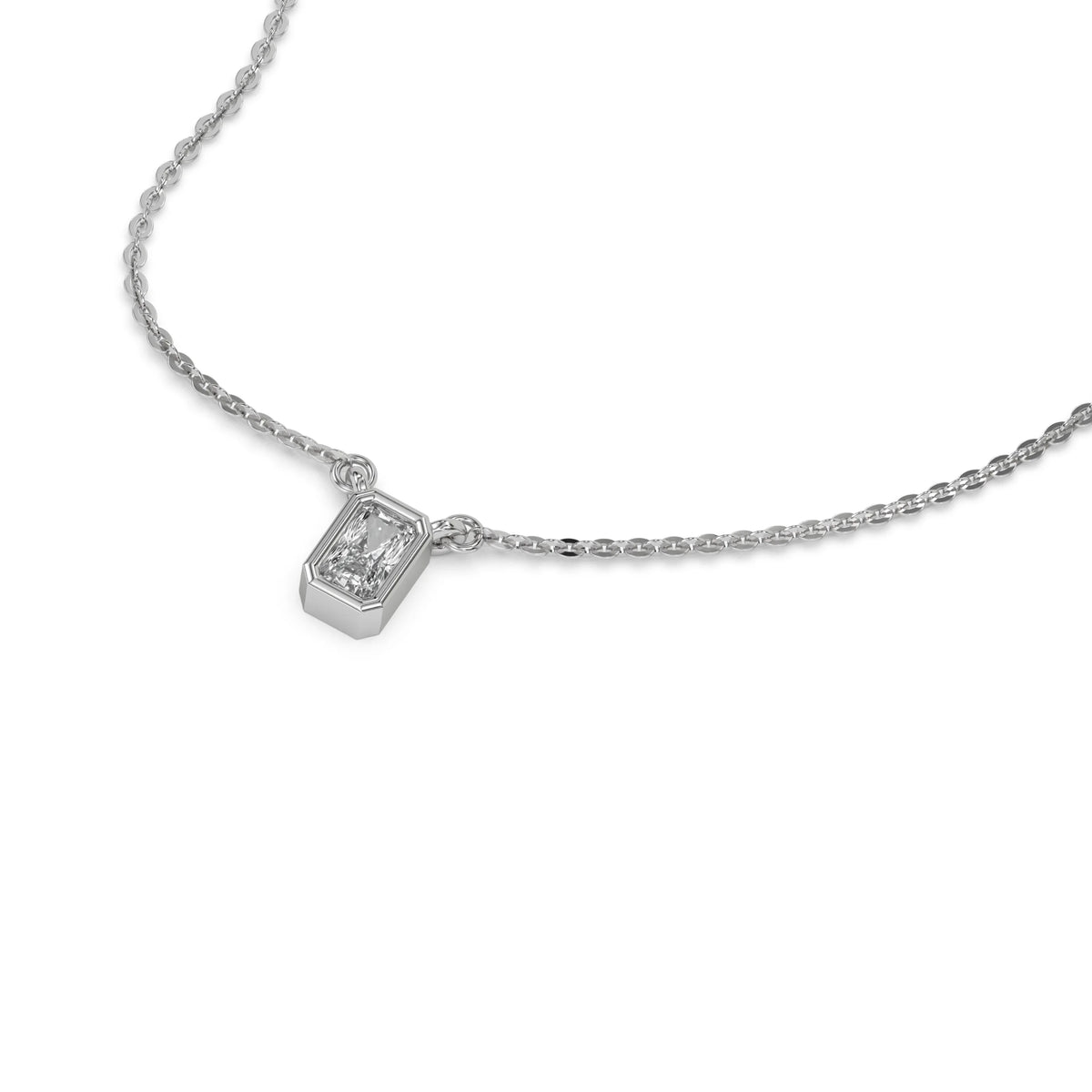 High-angle view of a bezel-set radiant Diamond necklace featuring an elongated solitaire stone in white gold.