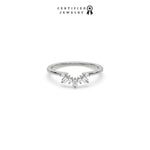 This white gold ring displayed in front view is made with round brilliant-cut diamonds and baguette diamonds all set in a shared prong setting