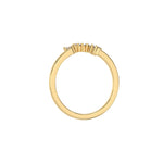 This yellow gold ring displayed in through finger view is made with round brilliant-cut diamonds and baguette diamonds all set in a shared prong setting