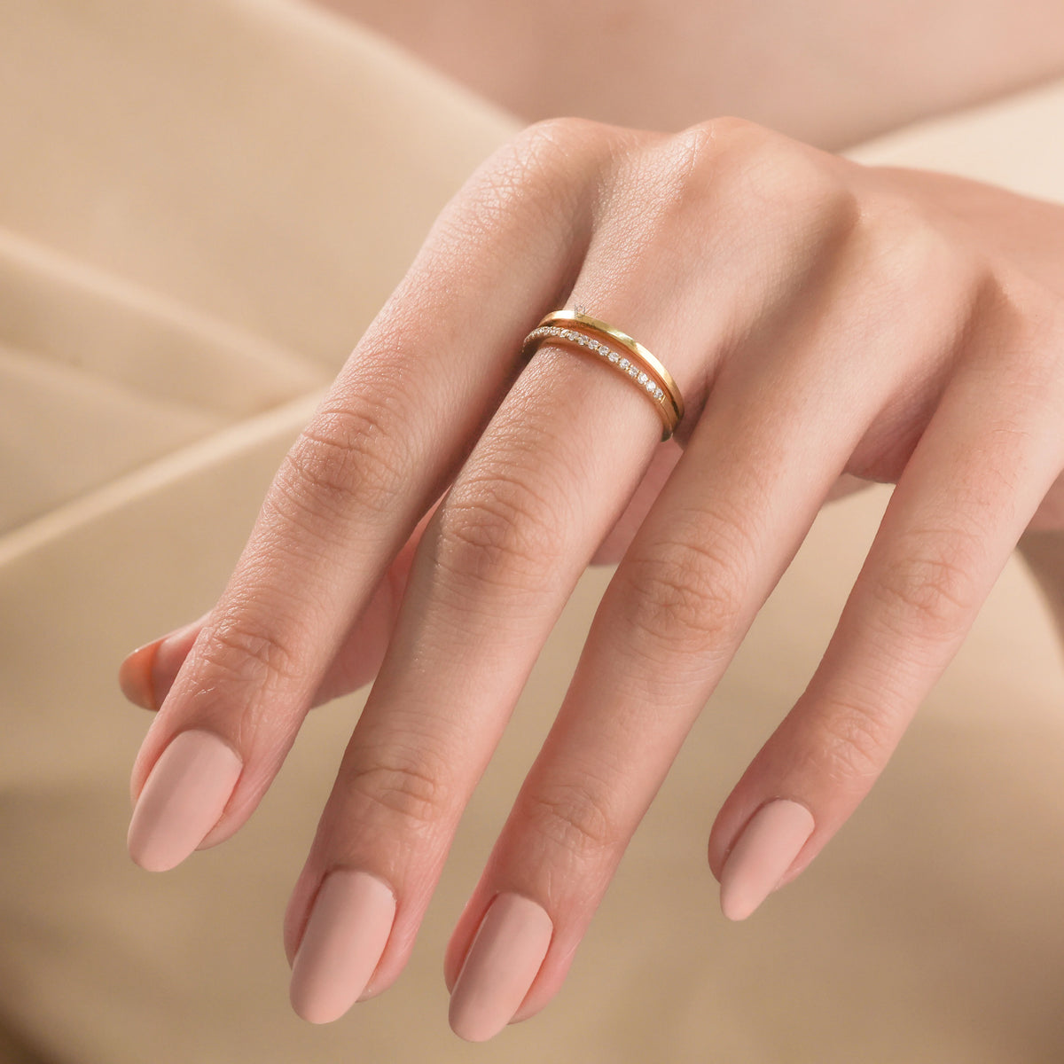 14k Yellow gold double row open ring with diamond pavé accent band, elegantly modeled on a woman's index finger to showcase lifestyle styling.