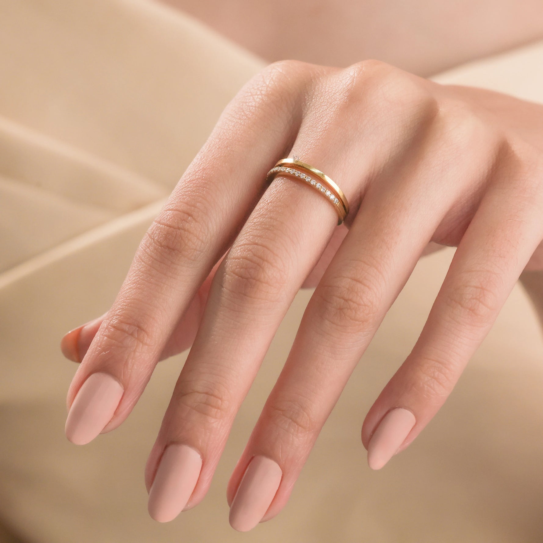 14k Yellow gold double row open ring with diamond pavé accent band, elegantly modeled on a woman's index finger to showcase lifestyle styling.