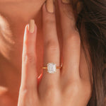 Yellow gold wedding ring showcasing a vintage-inspired marquise diamond focal stone enclosed by a glittering micro pavé diamond accent halo border setting.