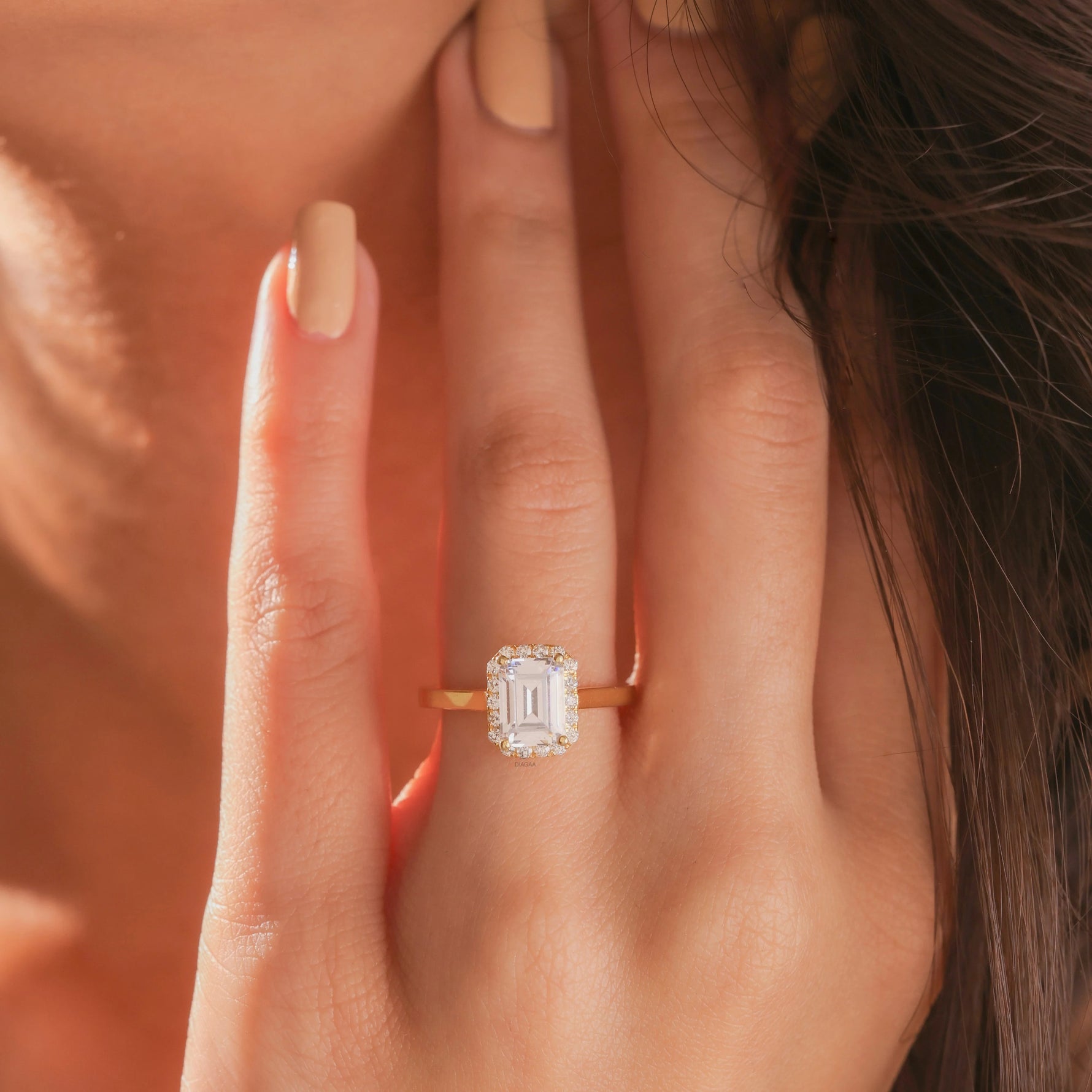 Yellow gold wedding ring showcasing a vintage-inspired marquise diamond focal stone enclosed by a glittering micro pavé diamond accent halo border setting.