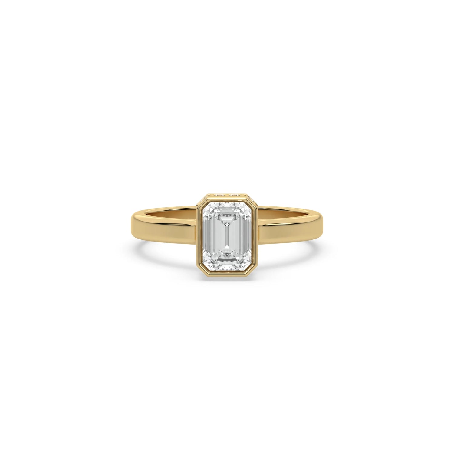 Emerald cut Solitaire diamond engagement ring with a modern yellow gold bezel setting on a plain band.