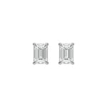 Pair of fine jewelry featuring an Emerald diamond stud earring in prong-set and yellow gold on a white background.