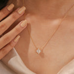 14K Yellow Gold Emerald and Round Cut Diamond Starburst Pendant