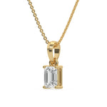 This yellow gold Emerald Solitaire Diamond Necklace made with an emerald cut diamond in a four prong setting with adjustable chain in side view