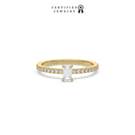 This yellow gold ring displayed in front view is made with a emerald solitaire diamond set in four-prong setting