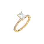 This yellow gold ring displayed in 3d view is made with a emerald solitaire diamond set in four-prong setting